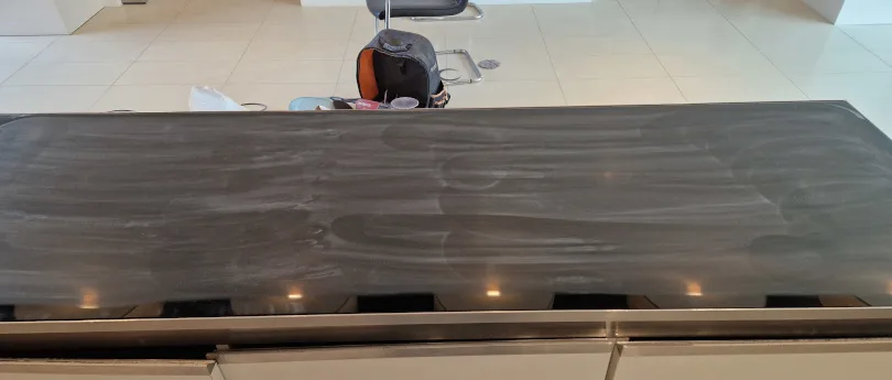glass scratches being removed from table top