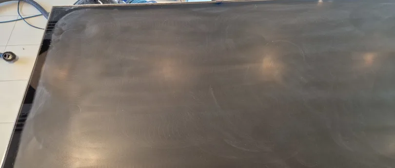 glass scratches being removed from table top