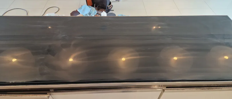 glass scratches being removed from table top