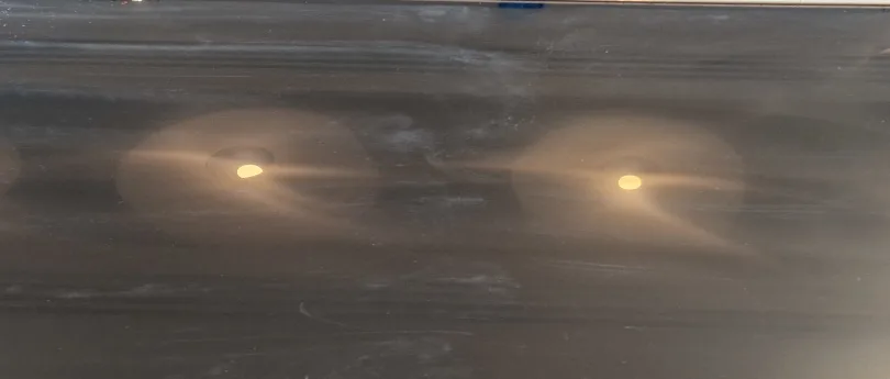 glass scratches being removed from table top