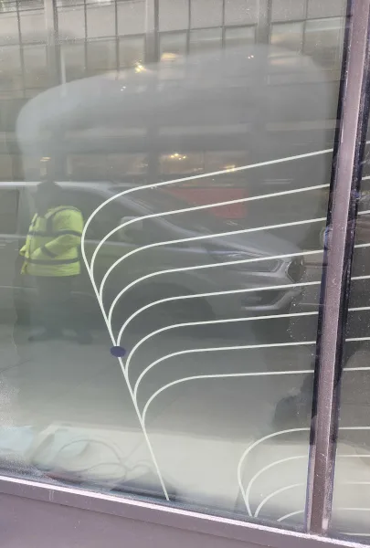 acid etched graffiti being removed