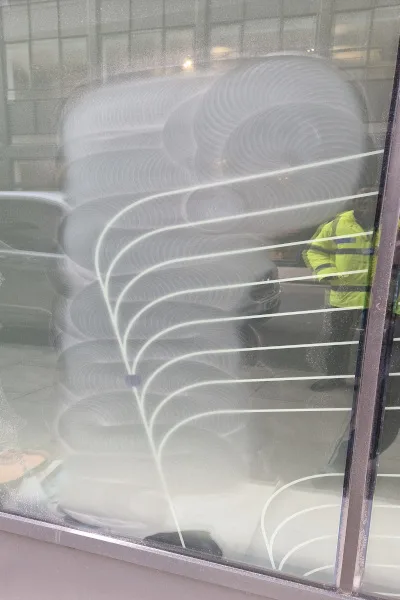 acid graffiti being removed from glass